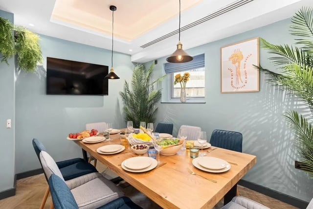 Wooden table with place settings and food dining area at London Road Apartments in Southampton Student Accommodation
