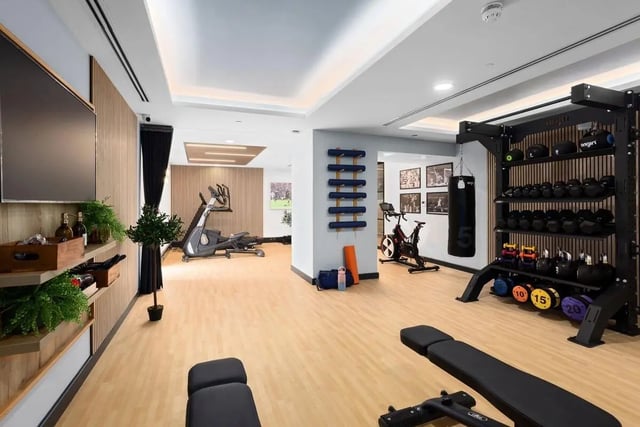 Dumbbells bench exercise bikes gym equipment playing area at London Road Apartments in Southampton Student Accommodation