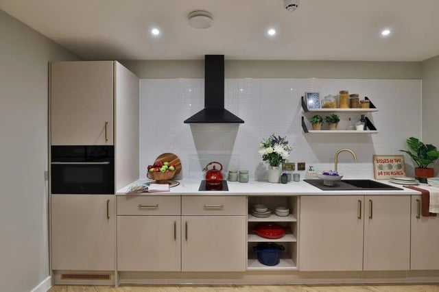 Modern kitchen with oven, kettle, fruit, and sink kitchen at London Road Apartments in Southampton Student Accommodation