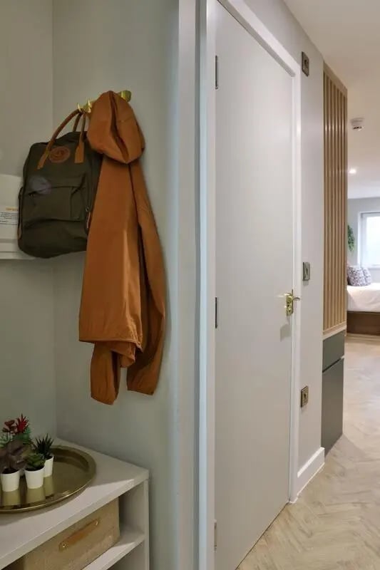 Backpack jacket and plants hallway interior at London Road Apartments in Southampton Student Accommodation