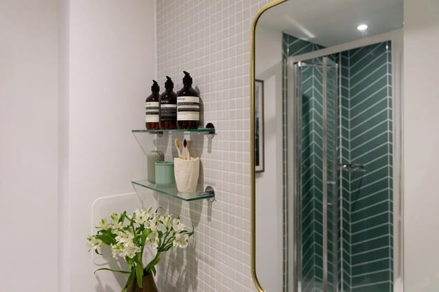 Shelves with toiletries and flowers bathroom interior at London Road Apartments in Southampton Student Accommodation