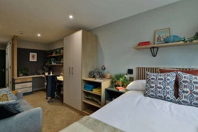 Bed desk wardrobe sofa living room bedroom at London Road Apartments in Southampton Student Accommodation