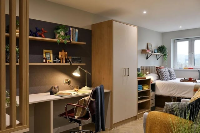 Desk bed wardrobe and shelves student accommodation room at London Road Apartments in Southampton Student Accommodation