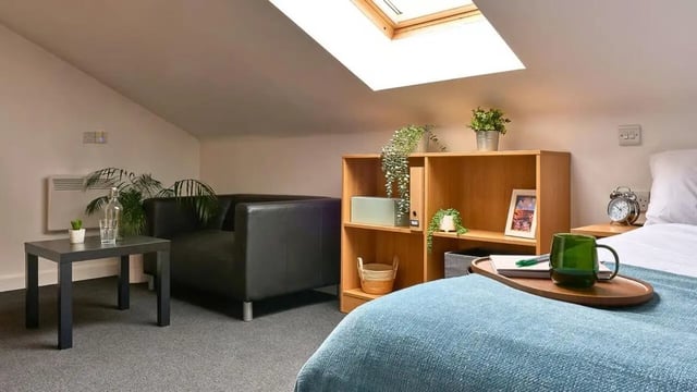 Sofa bookshelf bed and desk Living room at The Apollo Works in Coventry Student Accommodation
