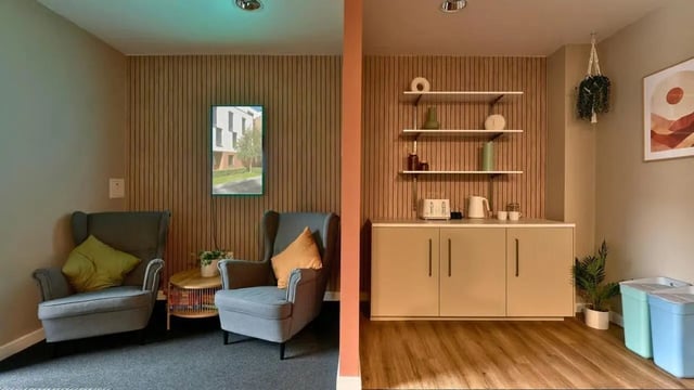 Two armchairs and kitchen counter with appliances kitchen area at The Apollo Works in Coventry Student Accommodation