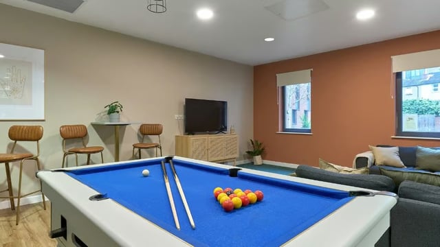 Pool table lounge area with TV and seating at The Apollo Works in Coventry Student Accommodation