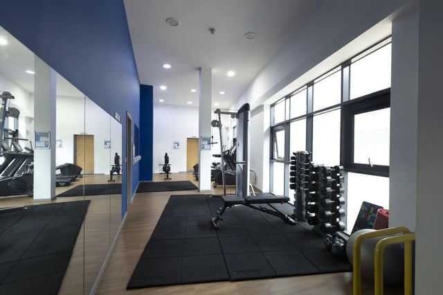 Dumbbells bench treadmill rowing machine gym at Rosedale Court in Newcastle Upon Tyne Student Accommodation