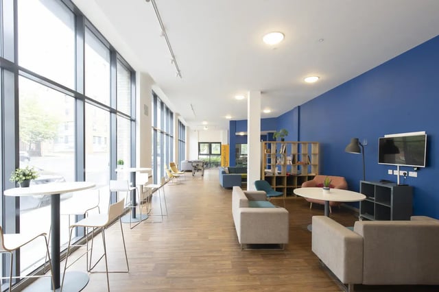 Sofas tables chairs and television in common room at Rosedale Court in Newcastle Upon Tyne Student Accommodation