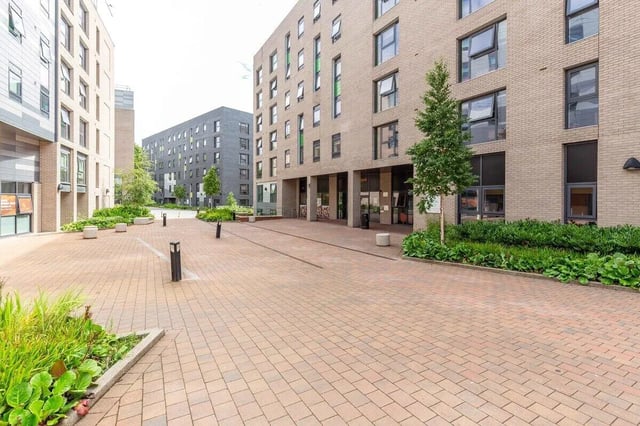 Modern buildings with trees and paved courtyard exterior at Bryson Court in Newcastle Upon Tyne Student Accommodation
