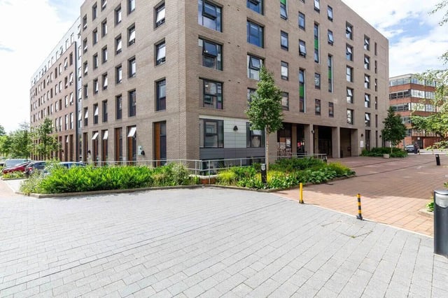 Brick building with many windows and landscaping exterior at Bryson Court in Newcastle Upon Tyne Student Accommodation