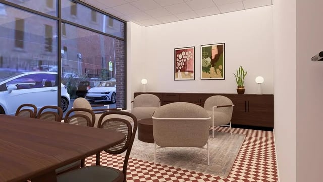 Dining table chairs artwork and seating area living room at St James Glasgow in Glasgow Student Accommodation