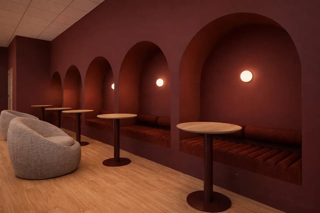 Arched booths with tables and seating lounge area at St James Glasgow in Glasgow Student Accommodation