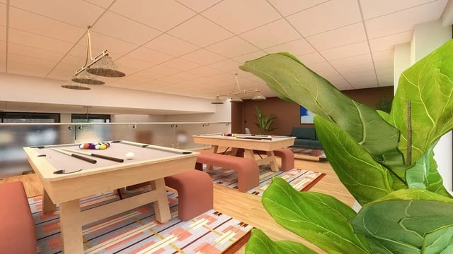 Pool tables with balls cues and benches playing area at St James Glasgow in Glasgow Student Accommodation