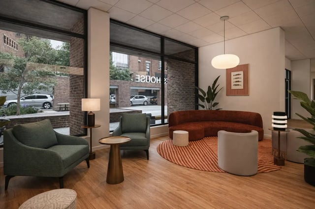 Modern living room with curved couch and chairs living room at St James Glasgow in Glasgow Student Accommodation