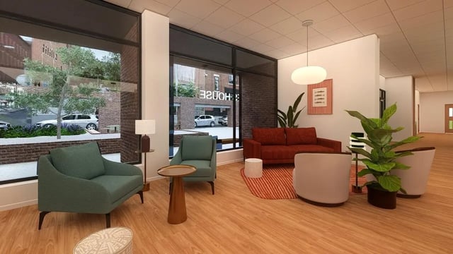 Sofas chairs rug plant artwork living room at St James Glasgow in Glasgow Student Accommodation