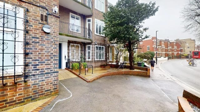 Brick building entrance with bike racks exterior at Francis Gardner in London Student Accommodation