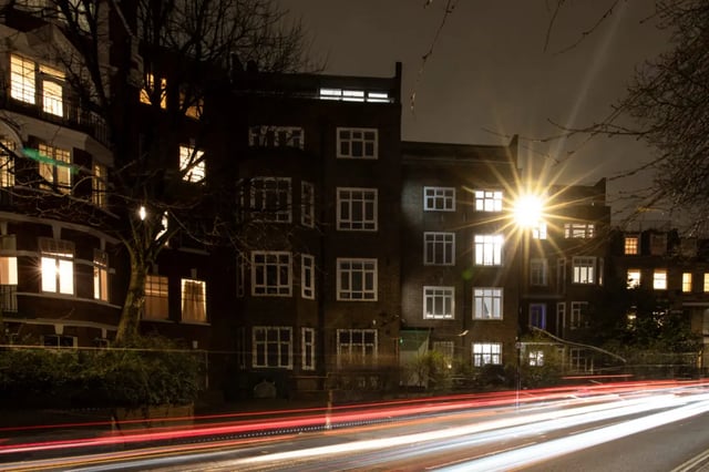 Dark building lit windows and car light trails exterior at Francis Gardner in London Student Accommodation