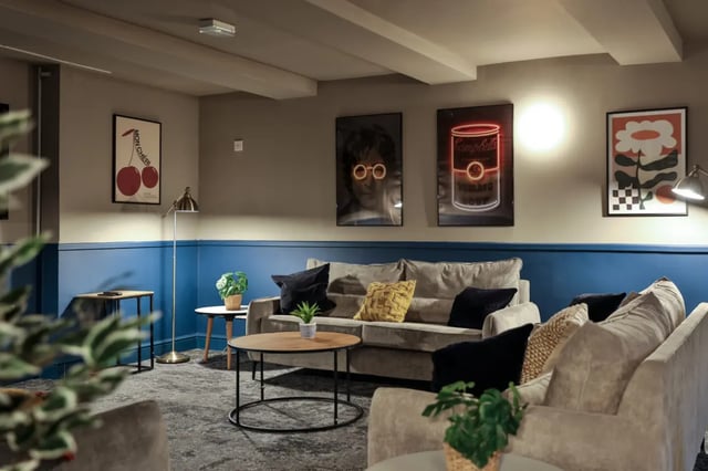 Sofas coffee table and art living room at Francis Gardner in London Student Accommodation