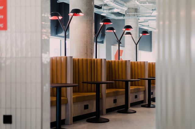 Booth seating with lamps and tables communal area at Vita Student Bruce Street in Belfast Student Accommodation