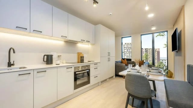 Modern kitchen with dining area living space living room at Press House in London Student Accommodation