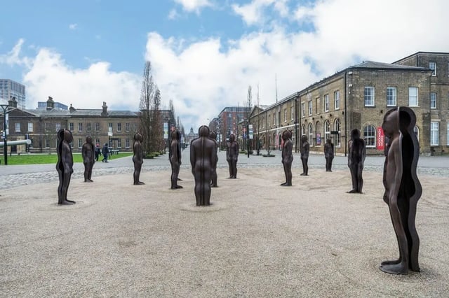 Sculptures of people arranged outdoors exterior at Press House in London Student Accommodation