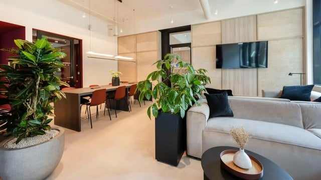 Sofa and dining table with chairs living room at Press House in London Student Accommodation