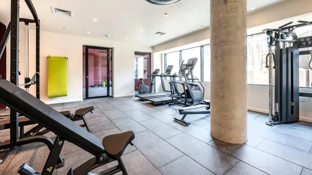 Gym equipment treadmills weight machines gym playing area at Press House in London Student Accommodation