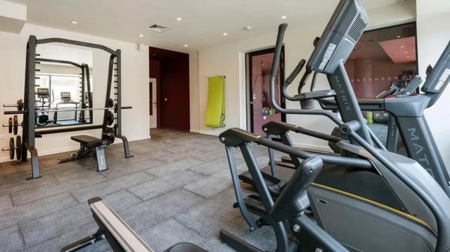Weight rack elliptical machines bench gym area at Press House in London Student Accommodation