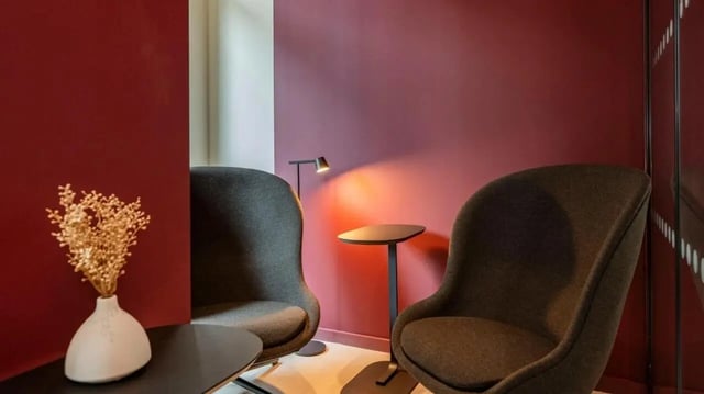 Two chairs table and lamp common area at Press House in London Student Accommodation