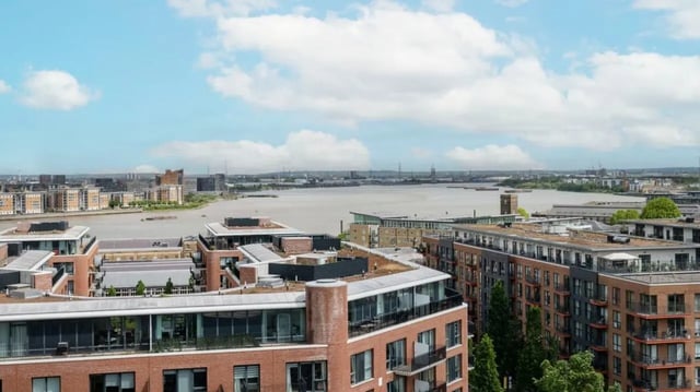Modern apartments overlooking water and city skyline exterior at Press House in London Student Accommodation