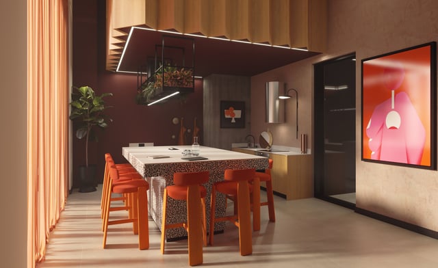 Island dining table with orange stools kitchen area at Vita Student Gough Street in Birmingham Student Accommodation