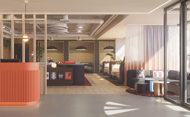 Reception desk couches booths and plants common area at Vita Student New Waverley in Edinburgh Student Accommodation