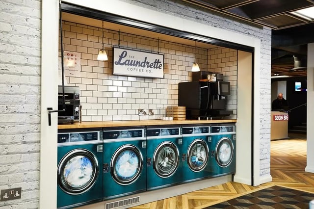 Washing machines coffee makers and counter area laundry room at Vita Student Telephone House - Sheffield in Sheffield Student Accommodation