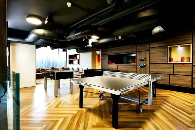 Ping pong table foosball table couches living room at Vita Student Telephone House - Sheffield in Sheffield Student Accommodation