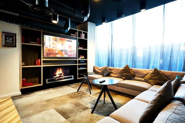 Large sectional sofa TV fireplace living room at Vita Student Telephone House - Sheffield in Sheffield Student Accommodation