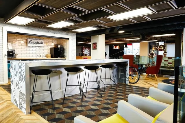 Bar with stools laundry area and seating area communal at Vita Student Telephone House - Sheffield in Sheffield Student Accommodation