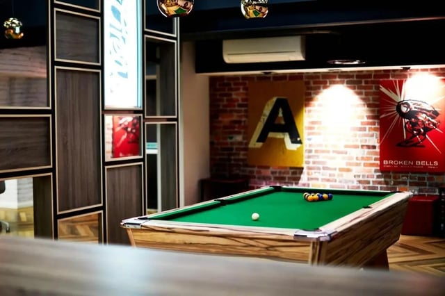 Pool table with balls and cue ball playing area at Vita Student Telephone House - Sheffield in Sheffield Student Accommodation