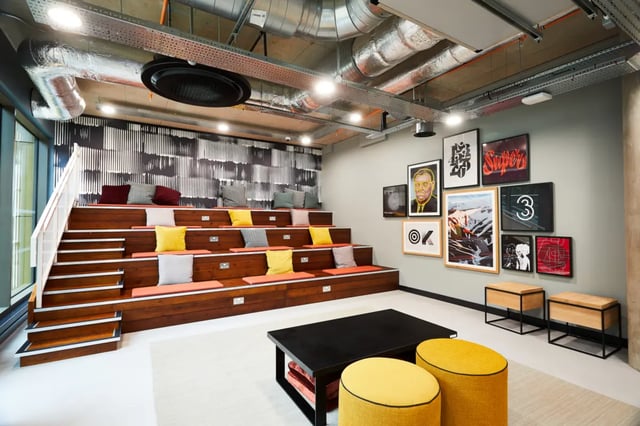 Tiered seating with colorful cushions communal area at Vita Student St.Albans in Leeds Student Accommodation