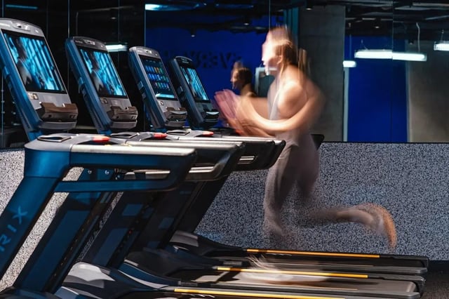 Treadmills and running woman gym area at Vita Student Copper Towers in Coventry Student Accommodation