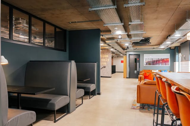 Booths lounge seating tables and chairs common area at Vita Student Station Street in Nottingham Student Accommodation