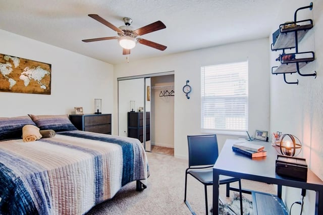 Bed dresser closet desk chair bedroom at Waypoint at Hammond in Hammond Student Accommodation