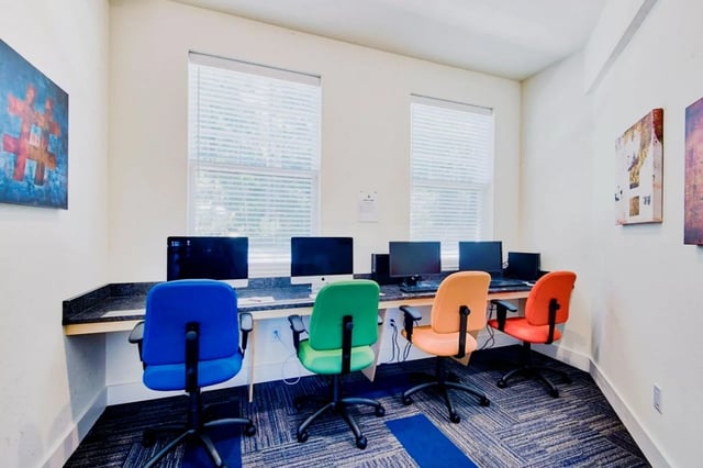 Computers with colorful chairs desk area study at Waypoint at Hammond in Hammond Student Accommodation