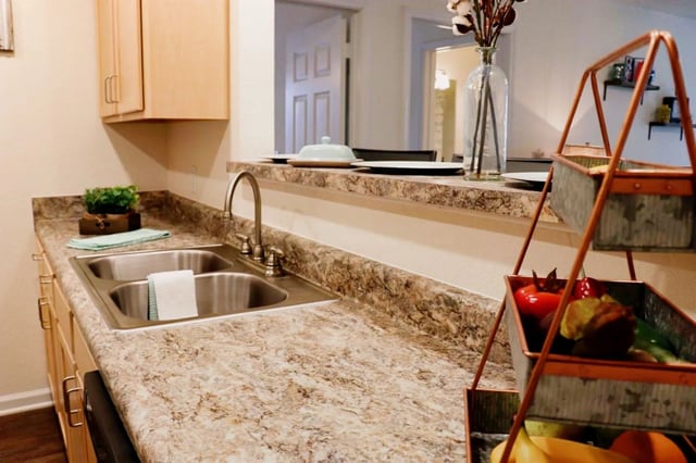Double sink countertops cabinets and fruit stand kitchen at Waypoint at Hammond in Hammond Student Accommodation