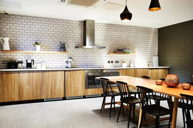Kitchen with dining table and chairs kitchen at Vita Student West End - Glasgow in Glasgow Student Accommodation