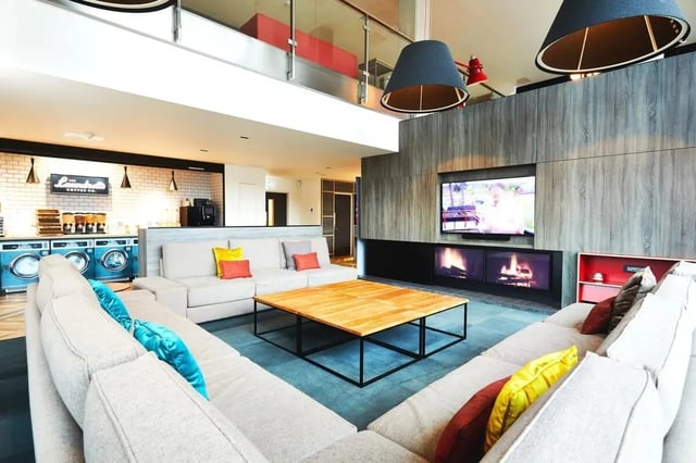 Sectional couch coffee table fireplace living room at Vita Student West End - Glasgow in Glasgow Student Accommodation