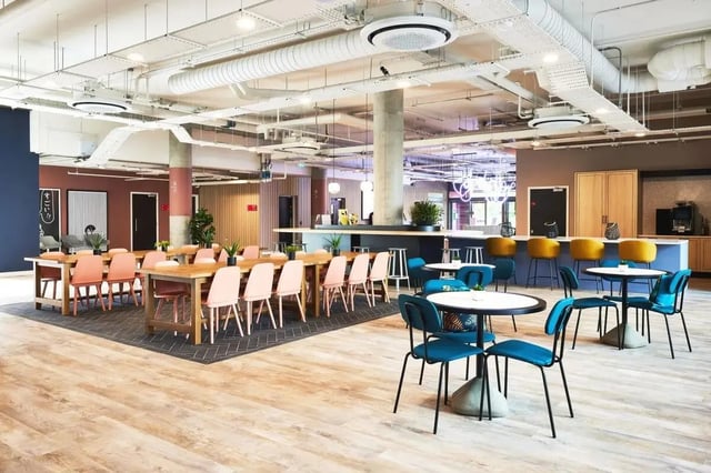 Dining tables chairs bar stools coffee machine communal area at Vita Student Cannon Park Warwick in Coventry Student Accommodation