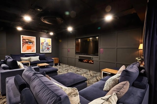 Plush sofas tv and fireplace communal area at Vita Student Portland Crescent in Leeds Student Accommodation
