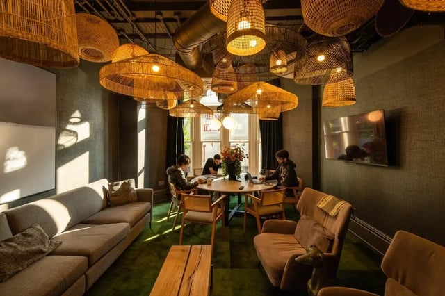 Students study at a round table living room at Vita Student Park Place in Cardiff Student Accommodation