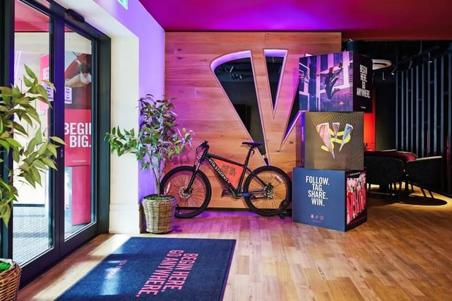 Bicycle plant and promotional displays entryway area at Vita Student Park Place in Cardiff Student Accommodation