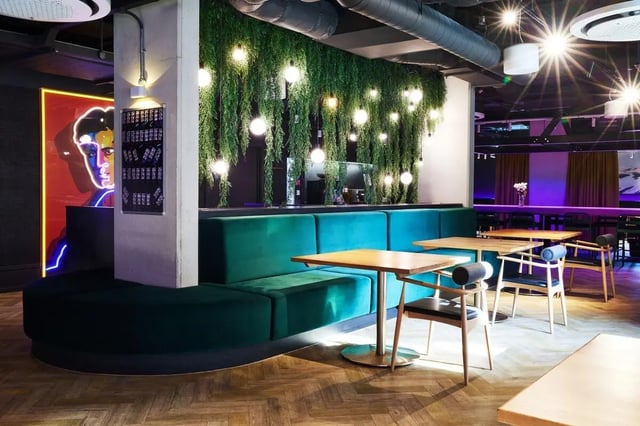 Green banquette tables and chairs communal area at Vita Student Park Place in Cardiff Student Accommodation